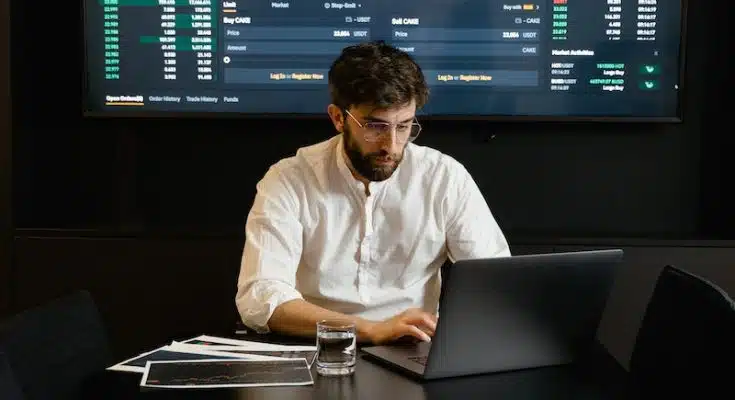 Focused Professional Man using Laptop